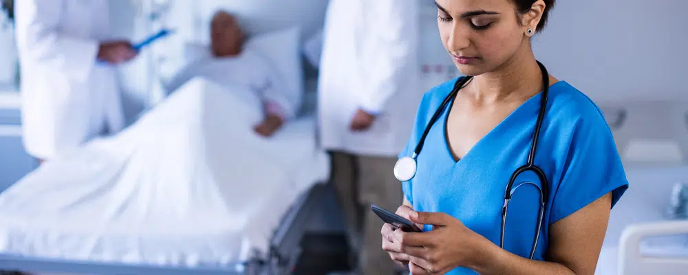 a nurse using a phone