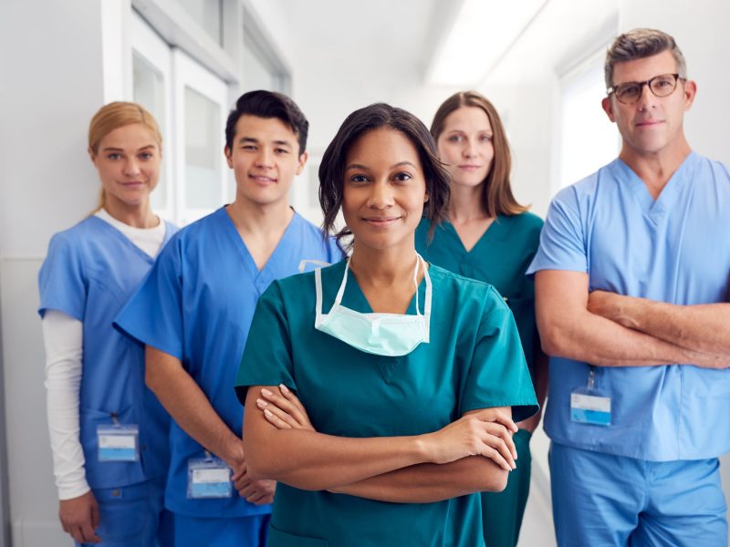 Portrait Of Multi Cultural Medical Team Standing In Hospital Corridor