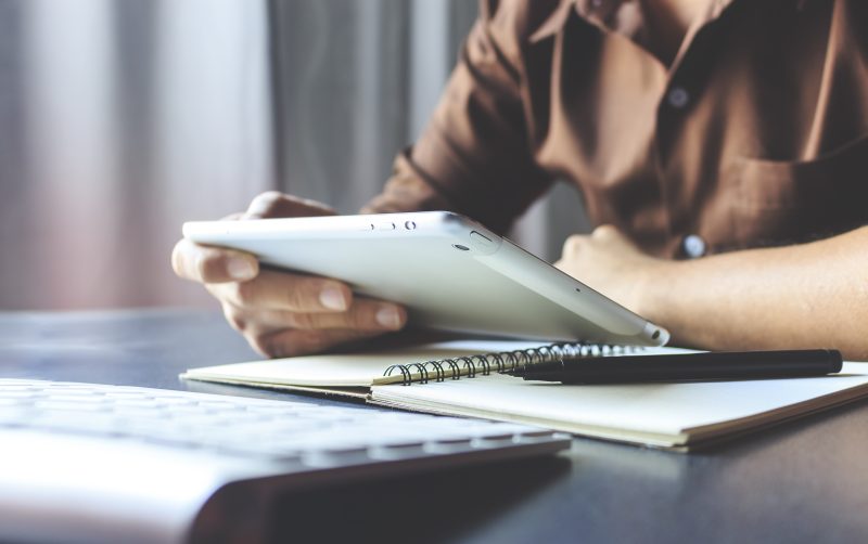 Businessman,Working,Tablet,In,Office,With,Film,Colors,Tone,,Soft focus