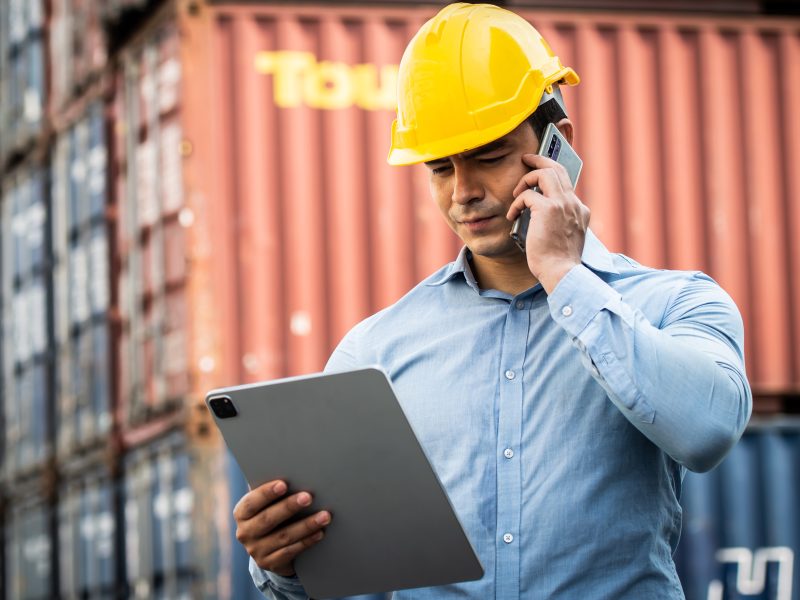 Caucasian,Worker,Use,Smartphone,And,Ipad,About,Business,Working,At