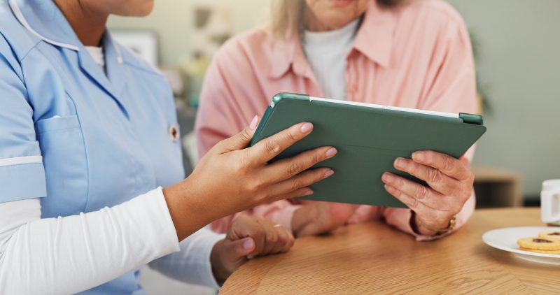 Tablet,,Caregiver,And,Hands,Of,Elderly,Woman,In,Home,For